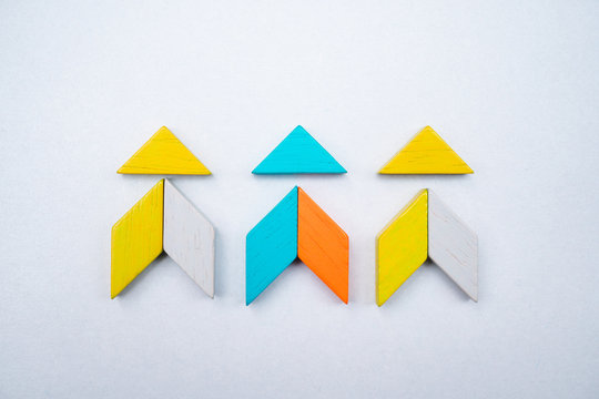 Tangram puzzle arrow shape use for education and creative concept