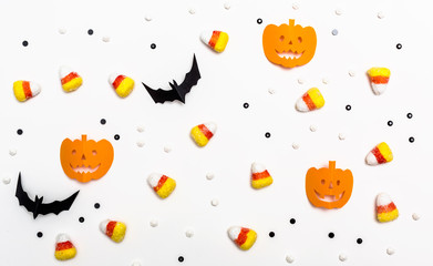 Halloween pumpkins on a white background - flat lay