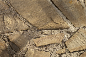 Floor from paving stones, irregular natural stones. Abstract background, texture image