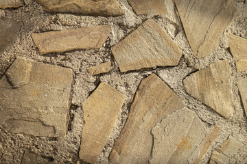 Floor from paving stones, irregular natural stones. Abstract background, texture image