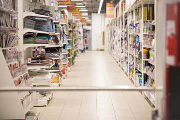 Picture blurred for background abstract. Blurred shelves in the supermarket with books and...
