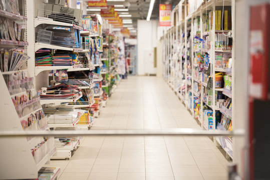 Picture blurred for background abstract. Blurred shelves in the supermarket with books and magazines.