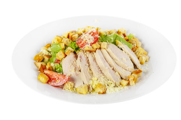 Caesar salad with slices of chicken breast, rusks, cherry tomato, lettuce, cheese on plate, white isolated background Side view. For the menu, restaurant, bar, cafe