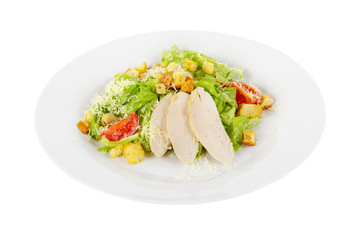 Caesar salad with slices of chicken breast, rusks, cherry tomato, lettuce, cheese on plate, white isolated background Side view. For the menu, restaurant, bar, cafe