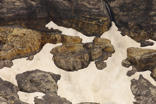 Detailed view of a rocky landscape with rests of a melting snow