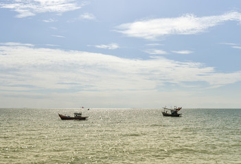 Fisherman boat at sea with blue sky background