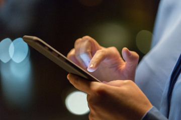 business, technology and people concept - close up of businesswoman hands with smartphone