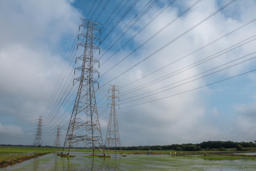 High voltage power on sky and cloud background.Transmission line tower.