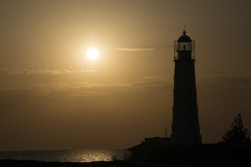The Tarkhankut lighthouse at sunset. Cape Tarkhankut, south-western cape of the Tarkhankut Peninsula, Crimea