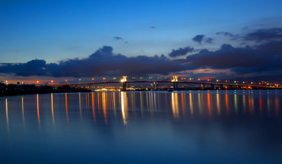 Fototapeta na wymiar two Mactan Bridges with reflections in Water, night shoot, long expose