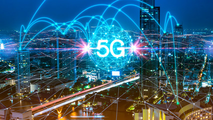 5G network digital hologram and internet of things on city background.5G network wireless systems.