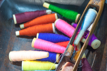 old tool to make the thread bobbin for the shuttle of ancient loom and Cotton is raw for weave, tools to work natural textile fiber