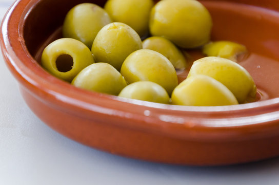 tapa of pitted olives in a plate