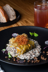golubtsi Cabbage with rice and meat on a plate of buckwheat and carrots