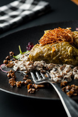 golubtsi Cabbage with rice and meat on a plate of buckwheat and carrots