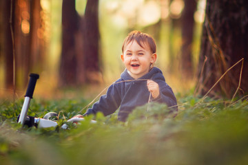 boy sitting in the grass