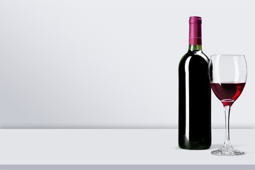 Red wine and glass on background