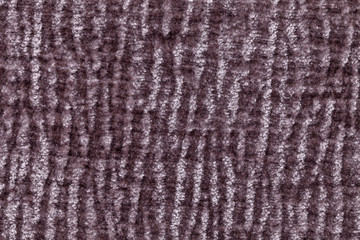Dark brown fluffy background of soft, fleecy cloth. Texture of textile closeup