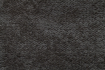 Fototapeta premium Black fluffy background of soft, fleecy cloth. Texture of light nappy textile, closeup.