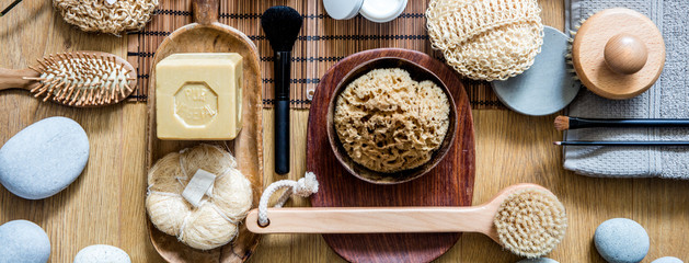exfoliation still life with many brushes, loofah and massage objects