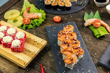 Wonderful sushi set, oriental theme on the old wooden table