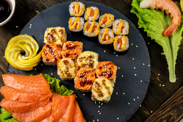 Wonderful sushi set, oriental theme on the old wooden table
