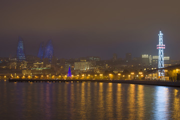 Fototapeta na wymiar View of the Seaside Park and the Towers in the late January evening, Baku