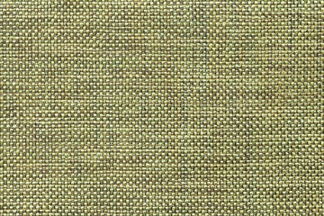 Light green textile background with checkered pattern, closeup. Structure of the fabric macro.