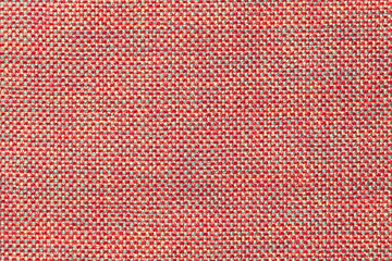 Dark pink textile background with chess pattern, closeup. Structure of the fabric macro.