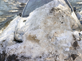 Abandoned Car Under Snow