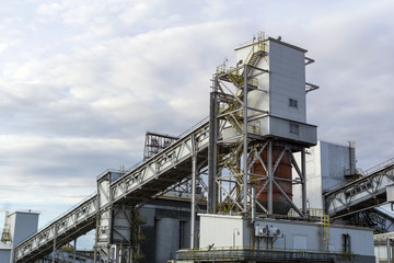 Industrial landscape - loading hopper for loose materials with inclined conveyor gallery