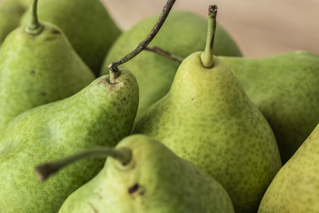 Some freshly harvested pears on a table.