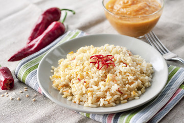 Spicy parboiled rice with carrots, yellow zucchini and chilli peppers