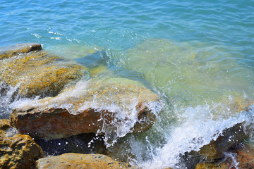 waves breaking on the shore with sea foam