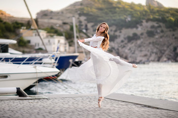 Elegant ballet dancer young girl dancing ballet outdoor