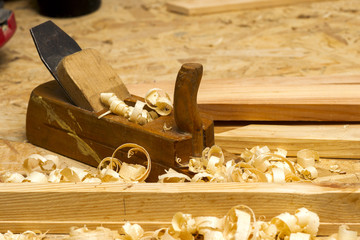 carpenter working,hammer,meter and screw-driver on construction background