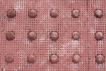 A close up view of the red rubber mat texture and surface.