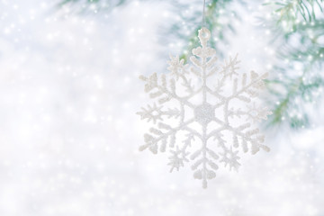 Christmas background, snowflake on a beautiful white background with snow.