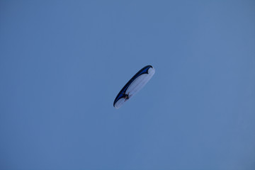 paraglider in the sky,fun,sport,flying,blue,fly,motorized paraglider,freedom,air