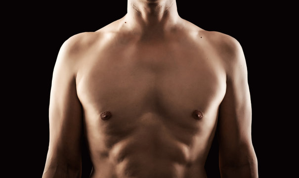 Perfect young adult male torso on black