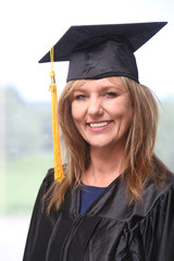 Attractive middle aged woman graduate, portrait of a college graduate.