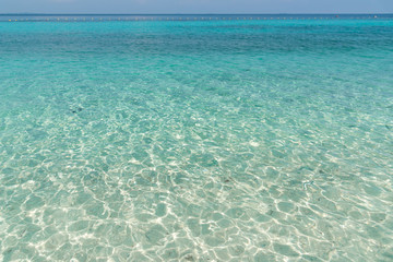 Turquoise water of the Koh Talu island with sand below surface , Rayong, Thailand , for background