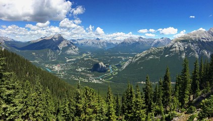 Fototapeta premium Sulphur Mountain in Banff National Park in the Canadian Rocky Mountains overlooking the town of Banff, river and famous hotel. The mountain with the hot springs on its lower slopes. Elevation 2451 m
