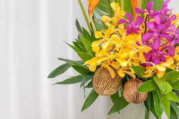 Colorful flowers bouquet in a vase on white background