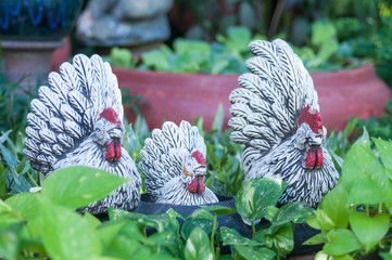 Decorative ceramic hen on a green grass