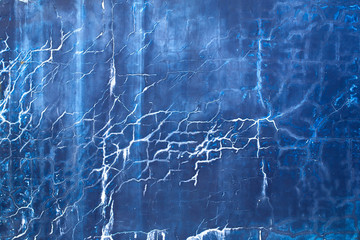 blue wall with cracks