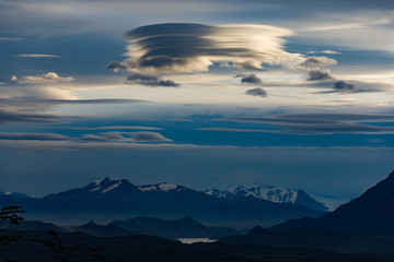 Obraz premium Lenticular clouds over the Andes taken from Torres del Paine, Patagonia, Chile at sunset in twilight.