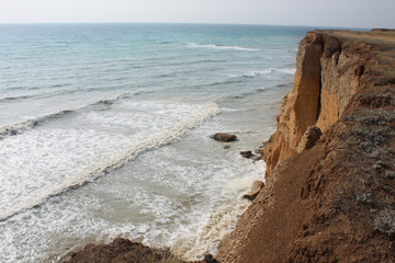 Fototapeta na wymiar Sea waves, surf. Rocks and cliffs. Black Sea. Summer. View from above