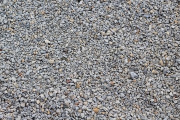 The small rocks and pebble gravel texture on a close view.