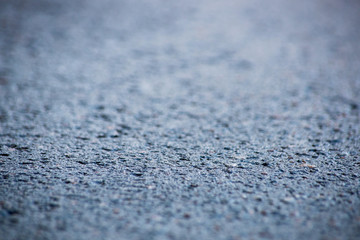 Abstract blue background with asphalt, soft focus